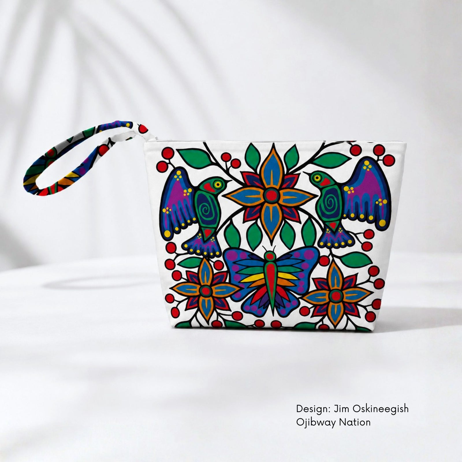 White canvas pouch featuring two colourful birds, a butterfly, blue and orange flowers, green leaves and red berries.