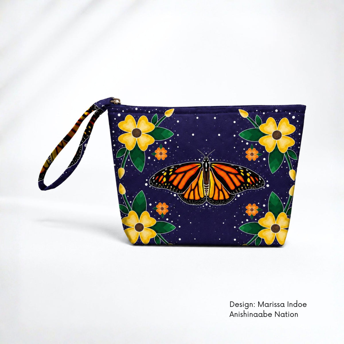 Deep blue canvas pouch featuring an orange monarch butterfly surrounded by yellow and orange flowers, green leaves and small white dots.