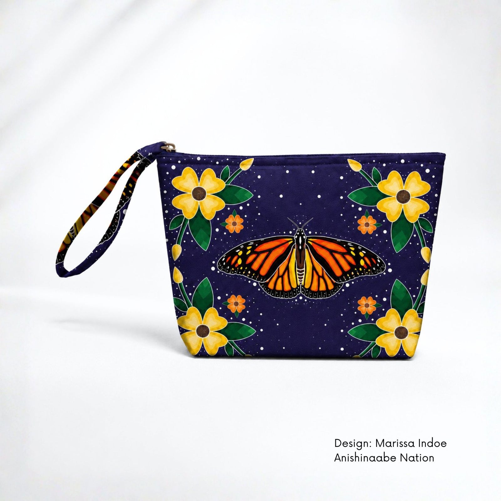 Deep blue canvas pouch featuring an orange monarch butterfly surrounded by yellow and orange flowers, green leaves and small white dots.