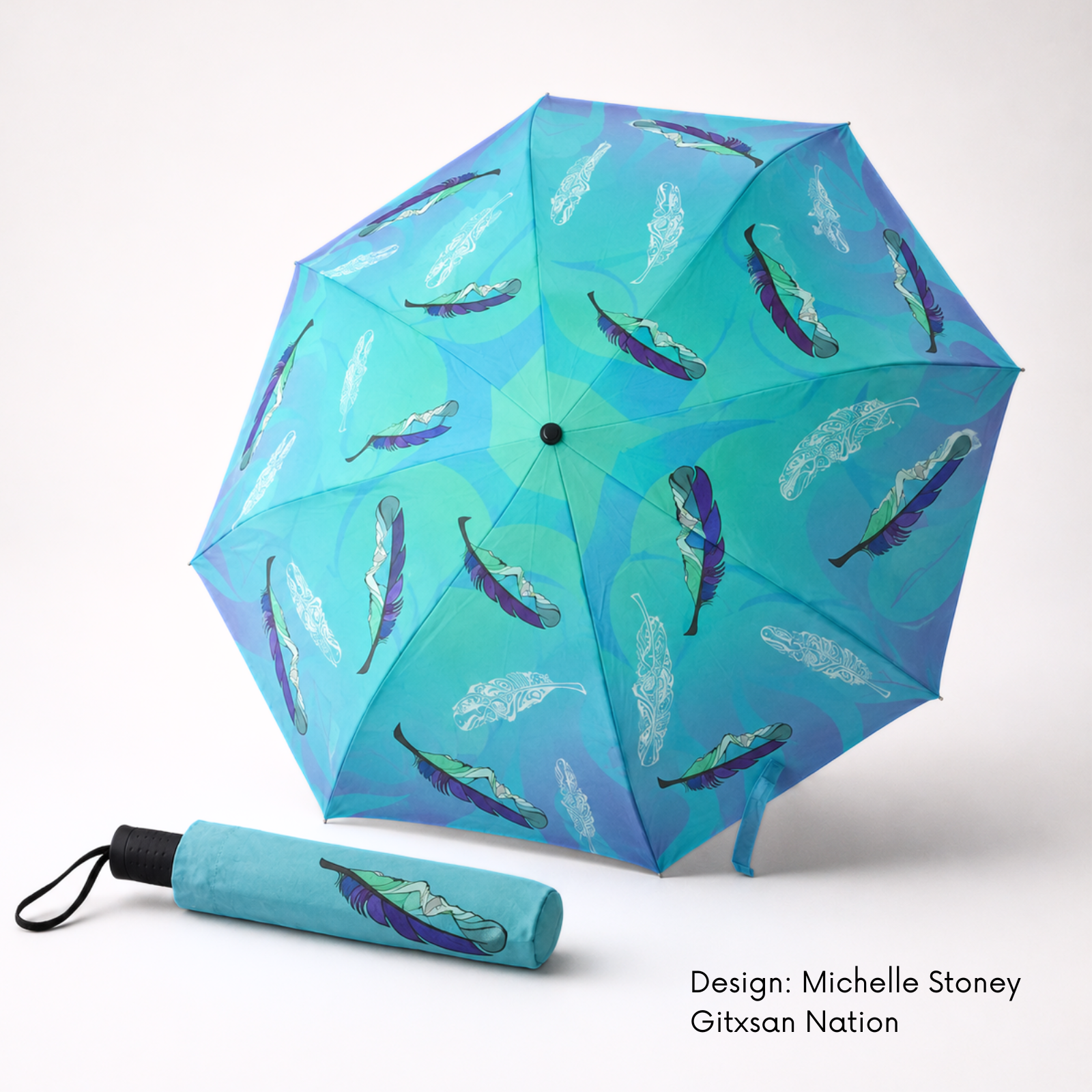 Open turquoise folding umbrella and matching sleeve featuring Michelle Stoney’s blue, purple and green Healing Feather artwork.