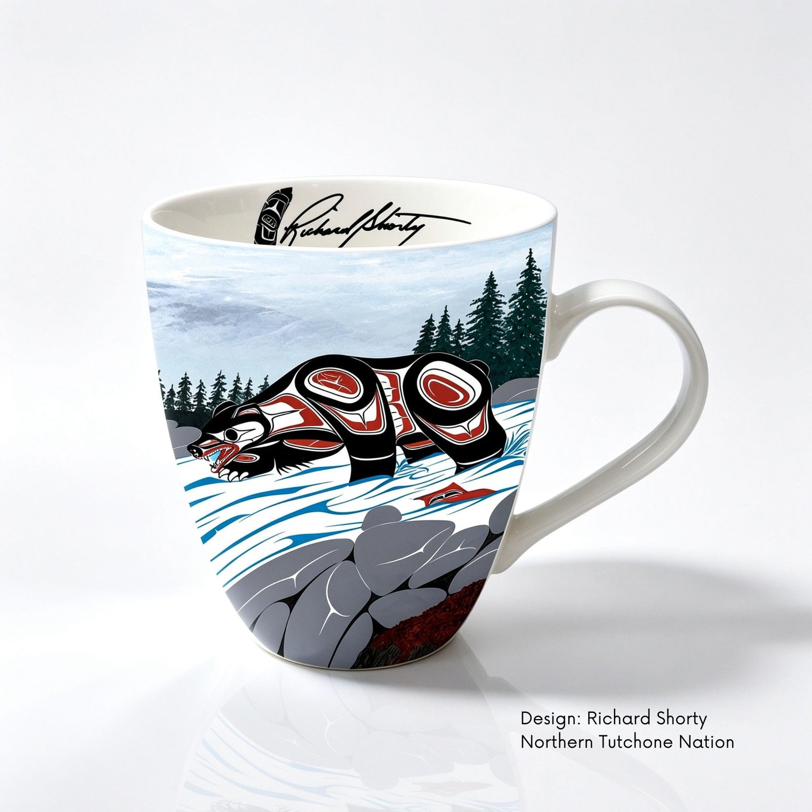Fine bone china mug featuring Cycle of Life artwork by Northern Tutchone artist Richard Shorty, with a bear design in black, red and white.