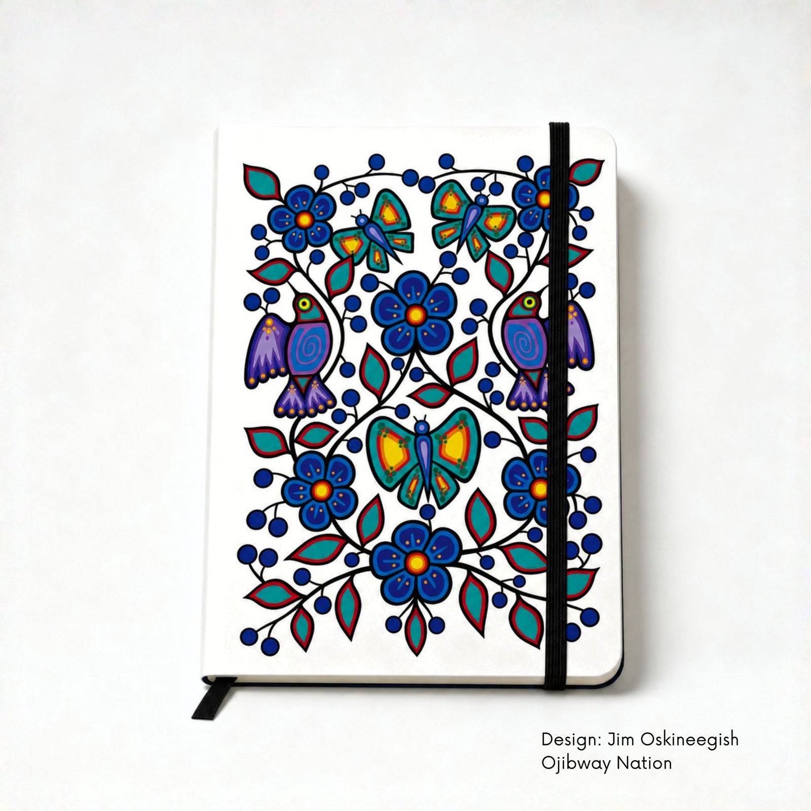 White hardcover journal featuring a colourful floral garden with blue flowers, red and green leaves, berries, butterflies and two purple birds.
