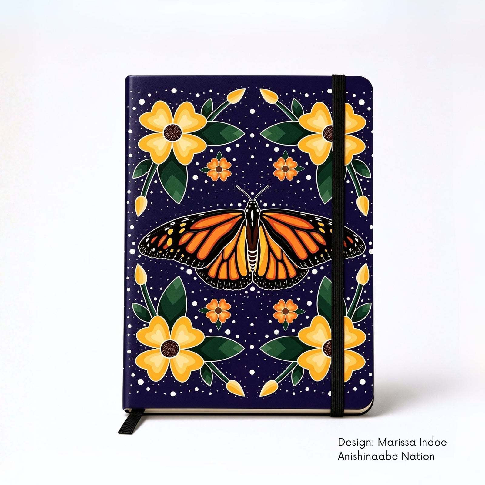 Hardcover journal featuring Marissa Indoe’s Monarch Butterfly, with a monarch butterfly surrounded by symmetrical red, yellow and blue flowers and leaves against a dark background.