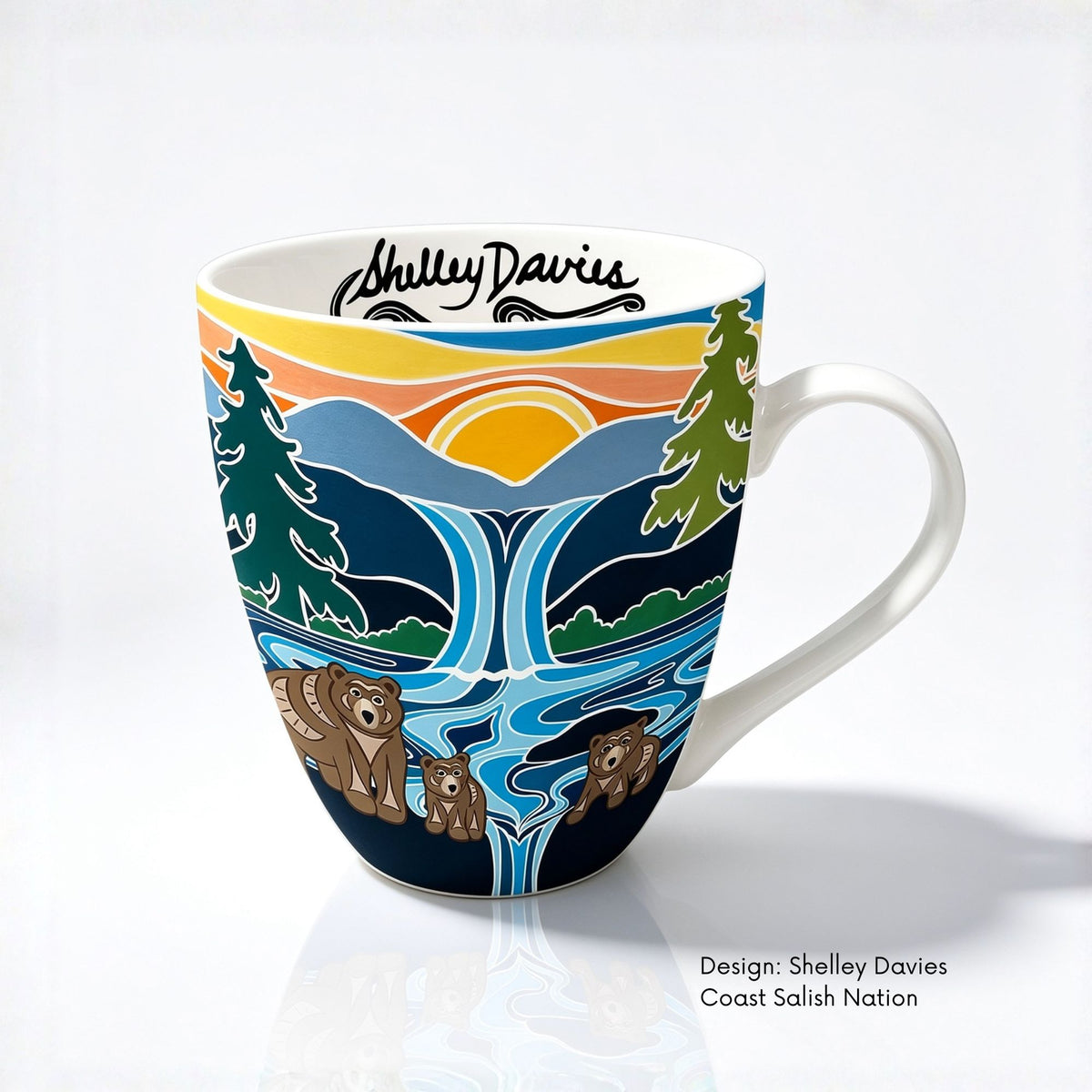 Fine bone china mug featuring One Last Swim artwork by Coast Salish artist Shelley Davies, with three bears swimming below a waterfall at sunset.