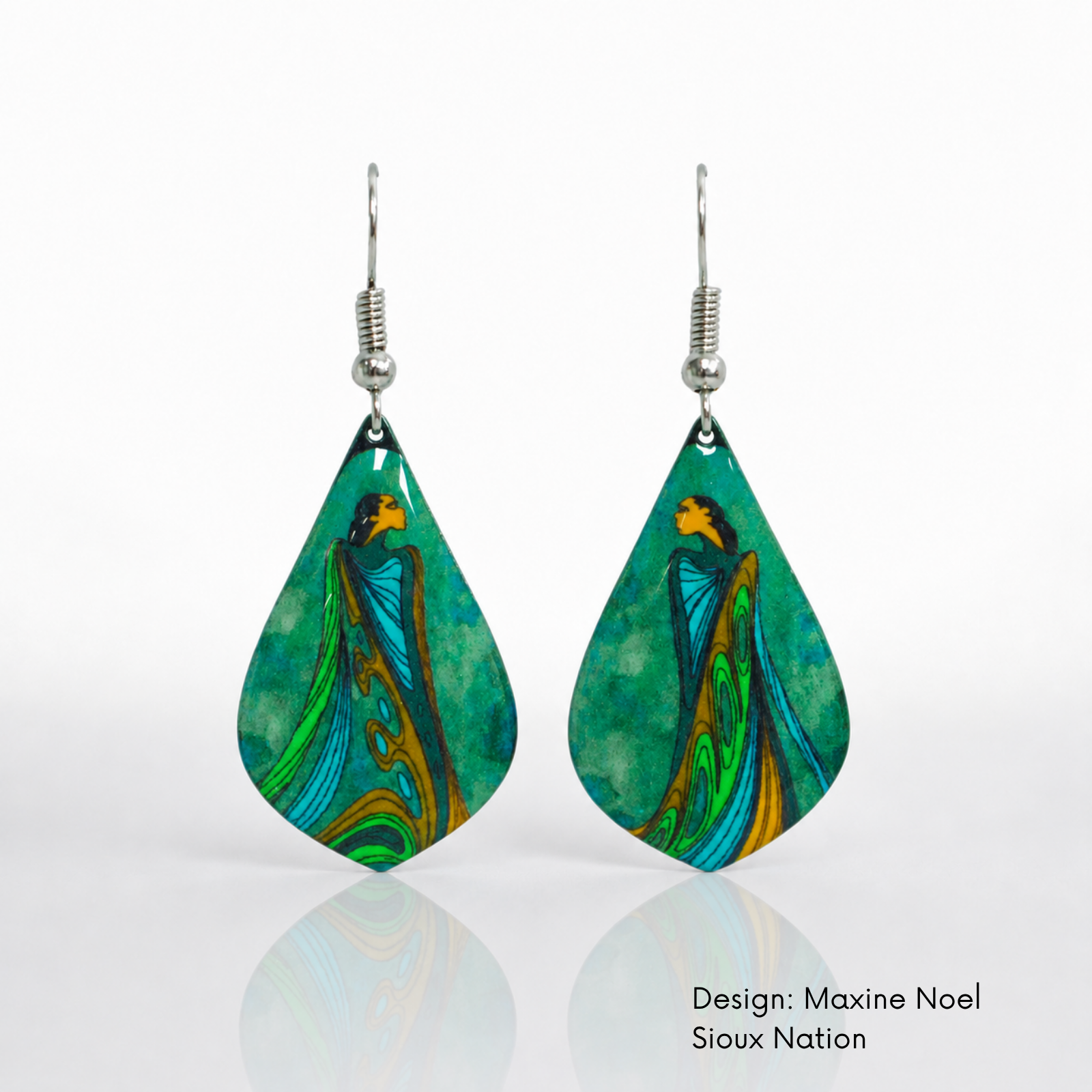 Close up of a Pair of oval earrings featuring two abstract figures surrounded by flowing blue, green and gold forms on a blond model.