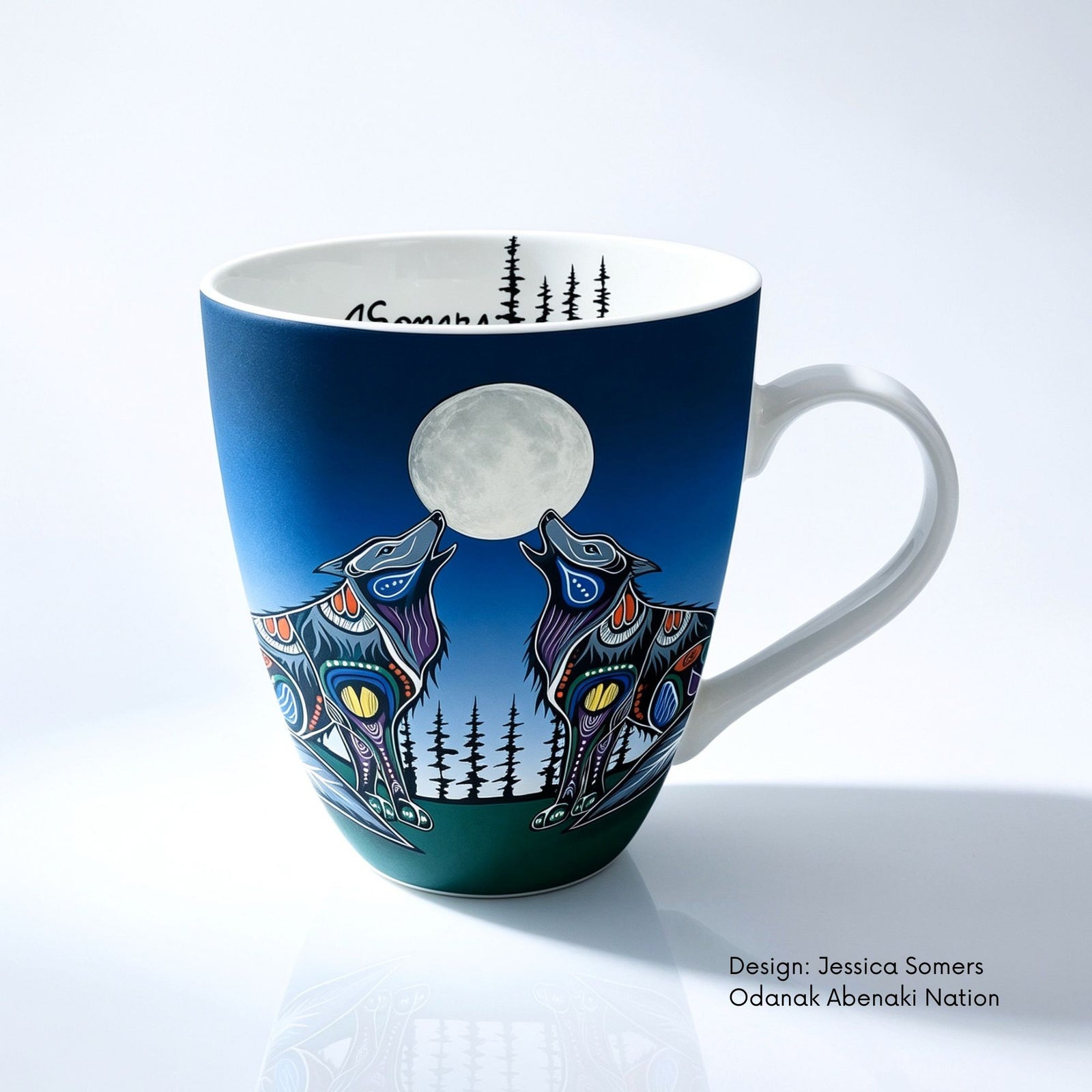 Fine bone china mug featuring Howling Duo artwork by Abenaki artist Jessica Somers, with two wolves howling beneath a full moon.