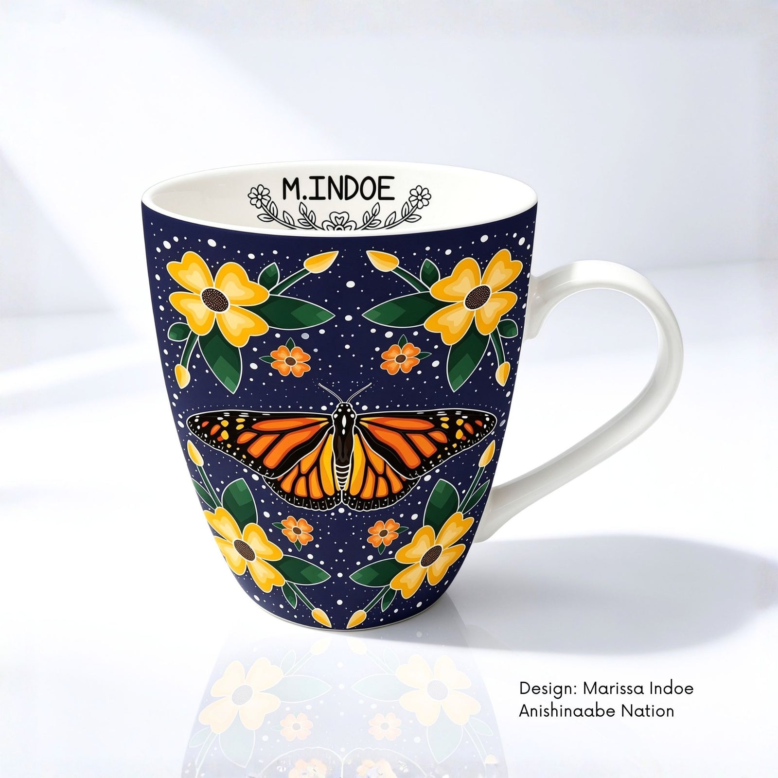 Fine bone china mug featuring Monarch Butterfly artwork by Anishinaabe artist Marissa Indoe.