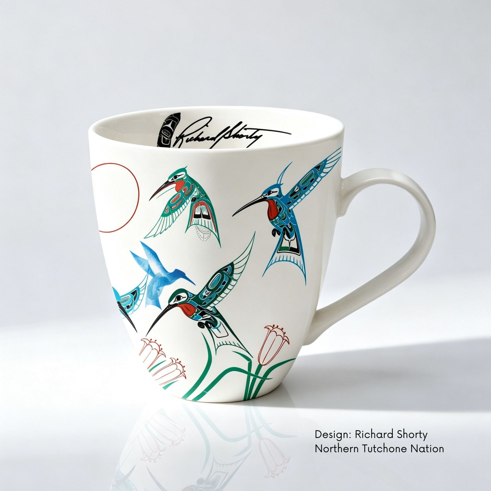 Fine bone china mug featuring Migration artwork by Northern Tutchone artist Richard Shorty, with colourful hummingbirds and flowers.